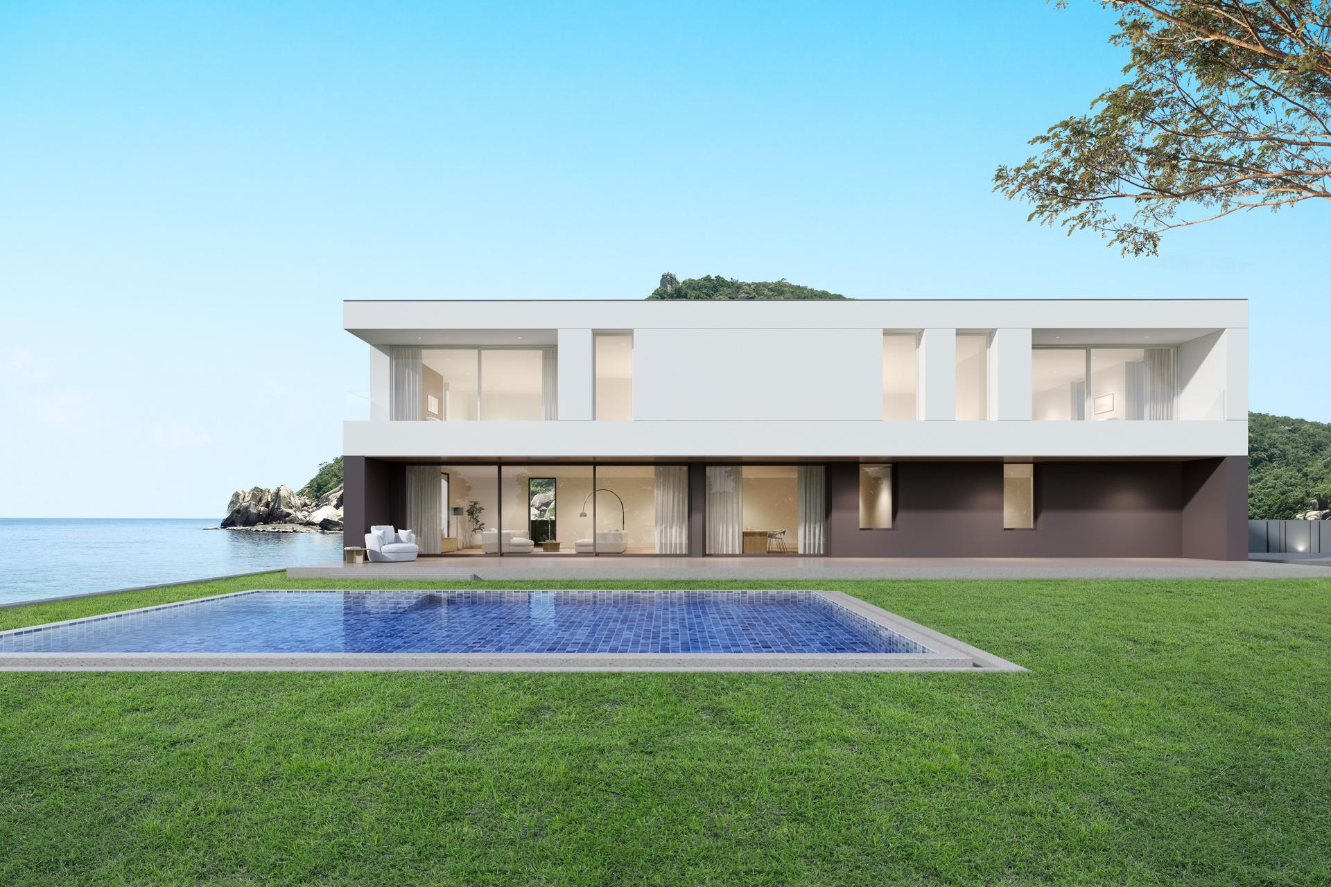 3d rendering of modern luxury house with swimming pool on sea background.